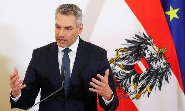 Interior Minister Karl Nehammer addresses the media in Vienna