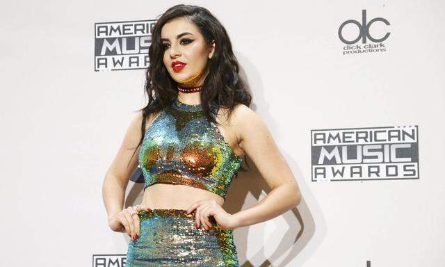 Charli XCX poses backstage during the 42nd American Music Awards in Los Angeles