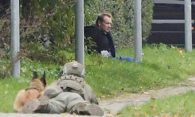 Peter Madsen is seen surrounded by police in Albertslund