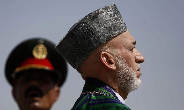 Präsident Karzai gibt kommendes Jahr sein Amt ab. Um seine Nachfolge bewerben sich Personen mit dunkler Vergangenheit. [ Reuters ]