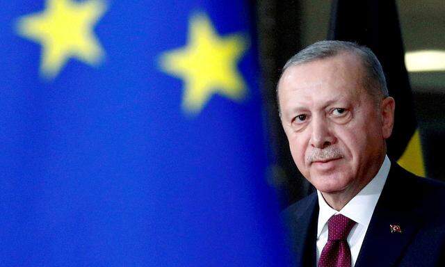 FILE PHOTO: Turkish President Tayyip Erdogan arrives for a meeting with EU Council President Charles Michel in Brussels