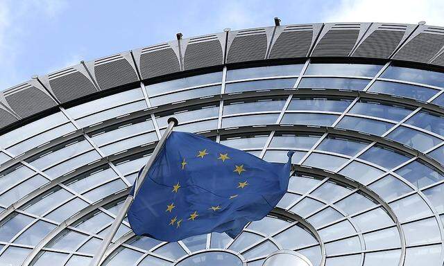 An European Union flag flutters outside of the European Parliament in Brussels
