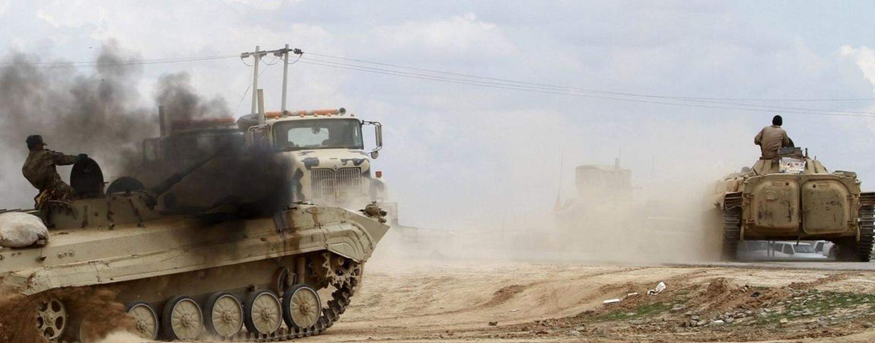 An Iraqi soldier rides in an armoured vehicle in Salahuddin