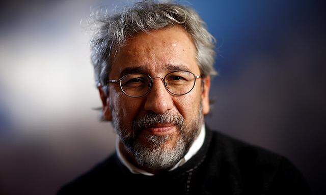Can Dundar, former editor-in-chief of Cumhurryiet, Turkey’s main opposition newspaper which was raided by Turkish police on Monday, is pictured after an interview with Reuters in Berlin