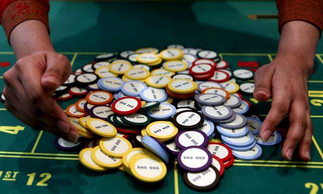 A casino collects chips at a roulette table in Pasay city, Metro Manila