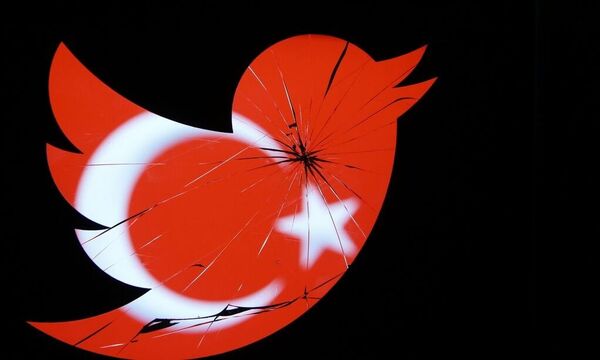 A Turkish national flag is seen through a broten Twitter logo in this photo illustration taken in Zenica