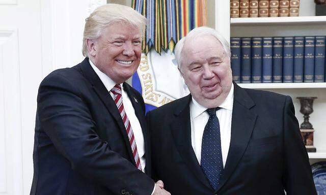 WASHINGTON D C USA MAY 10 2017 US President Donald Trump L shakes hands with Russian Ambass