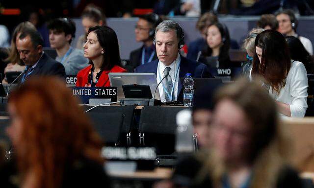 Participants take part in plenary session, during the final day of the COP24 U.N. Climate Change Conference 2018 in Katowice