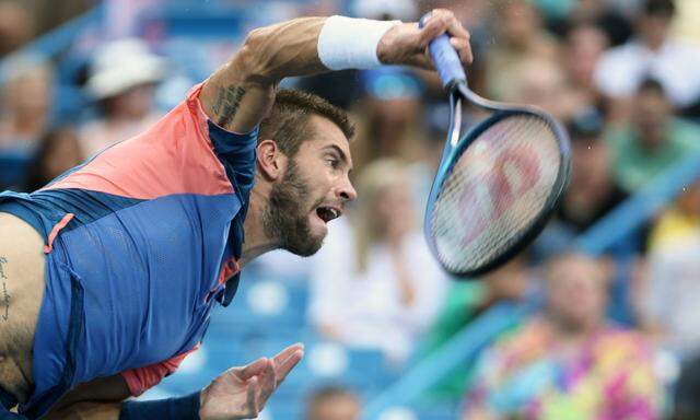 Borna Coric of Croatia in action against Greek tennis player Stefanos Tsitsipas, in the finals of the 2022 Western and