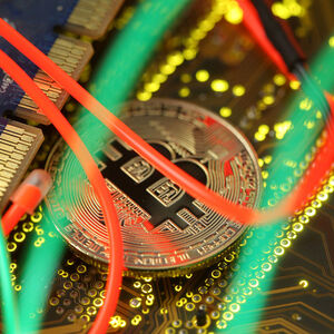FILE PHOTO: Representation of the Bitcoin virtual currency standing on the PC motherboard is seen in this illustration picture