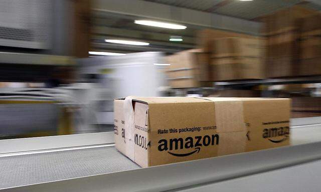 A parcel moves on the conveyor belt at Amazon's logistics centre in Graben in this file photo