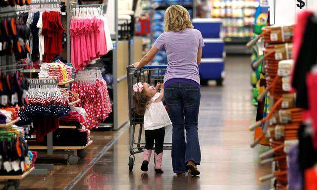 FILE PHOTO: A woman shops with her daughter at a Walmart Supercenter in Rogers