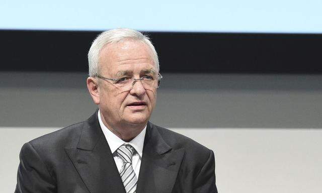 Volkswagen Chief Executive Winterkorn stands next to interim chairman Huber, former boss of the IG Metall labour union, at the Volkswagen annual shareholder meeting in Hanover