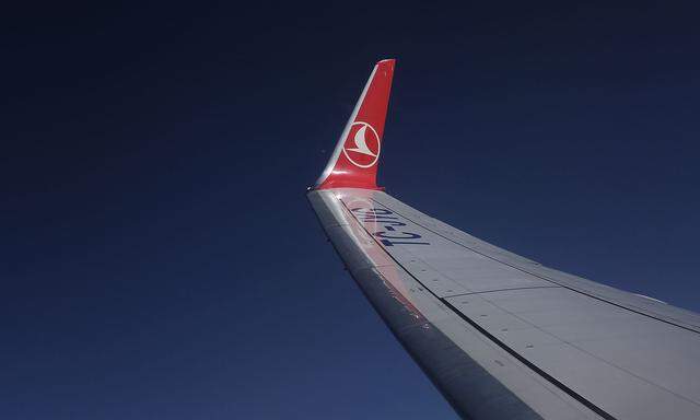 The logo of Turkish Airlines (THY) is pictured on the wing of a Boeing 737-900 ER aircraft as it gets ready to land at Ataturk International airport in Istanbul