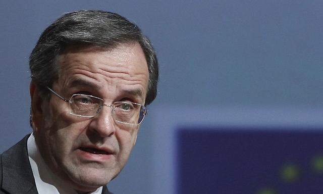 Greece's Prime Minister Antonis Samaras delivers his speech during a conference at the Athens Concert Hall