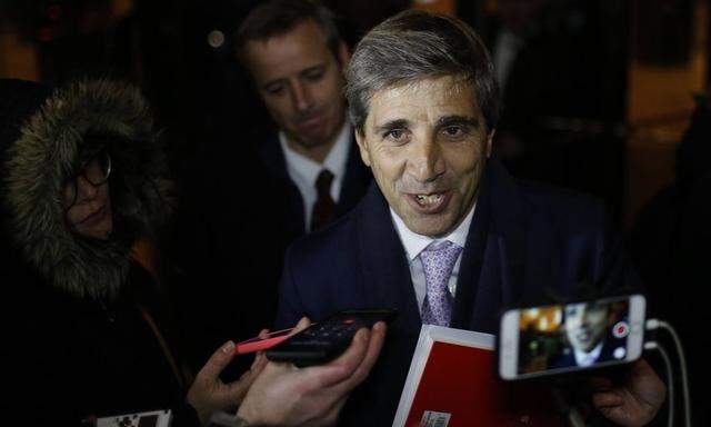 Argentinian Secretary of Finances Luis Caputo speaks with journalists after the first meeting to neg