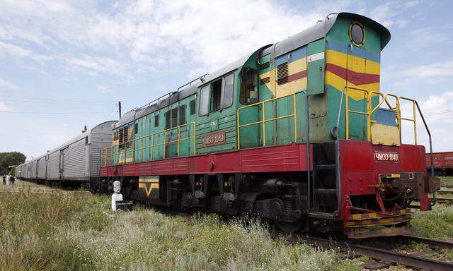 A train of refrigerator wagons, which according to employees and local residents contain bodies of passengers of the crashed Malaysia Airlines Boeing 777 plane, at a railway station in the town of Torez