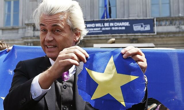 Dutch far-right Freedom Party (PVV) leader Geert Wilders holds a star he had just cut from the European Union flag during a demonstration in front of the EU Parliament in Brussels