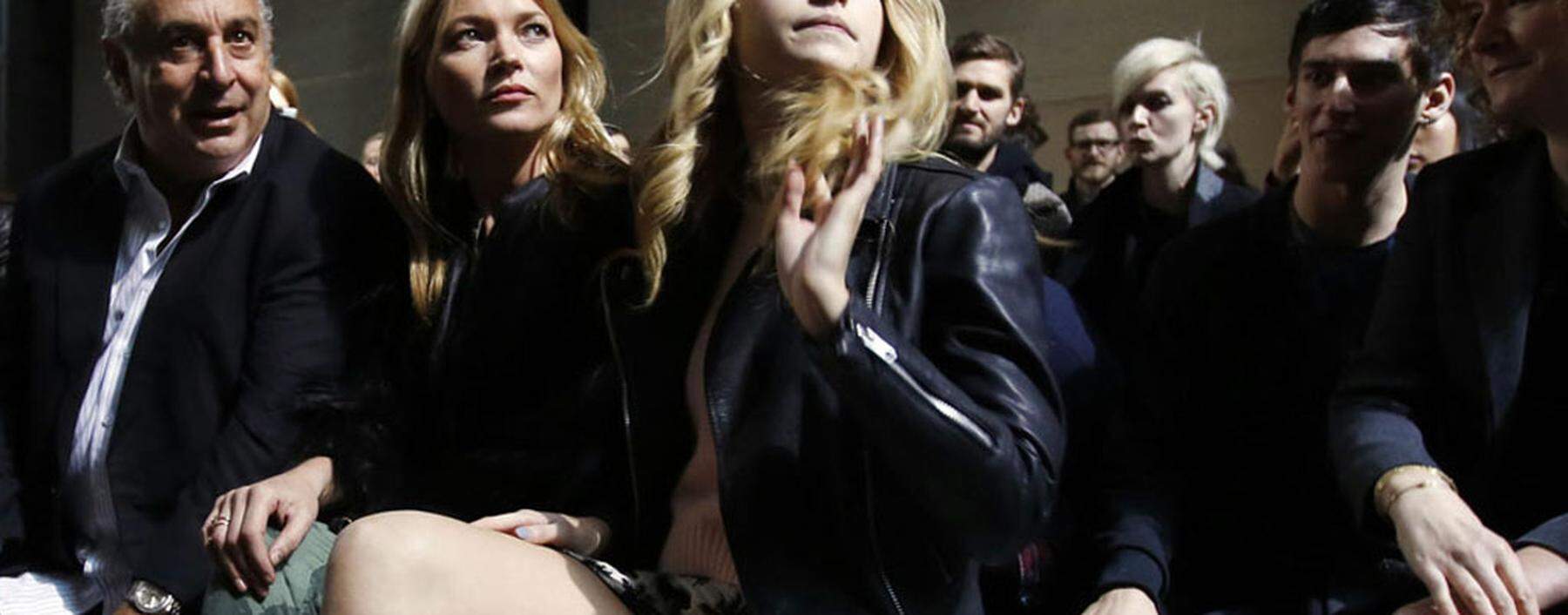 Philip Green, former model Kate Moss and her sister Lottie Moss sit in the front row before the Topshop Unique Autumn/Winter 2014 catwalk show during London Fashion Week