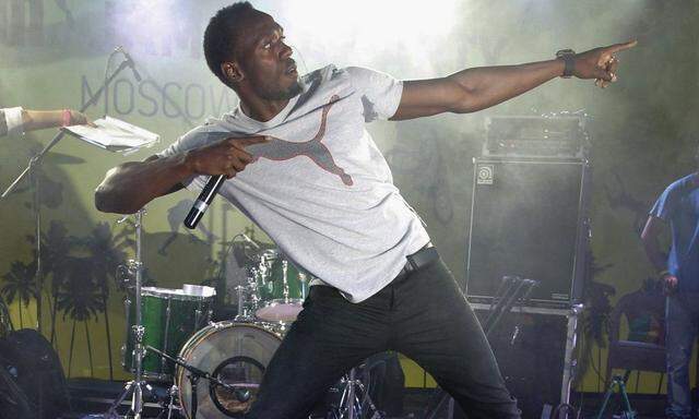 Usain Bolt dances during a Jamaican-themed party, at a club in Moscow