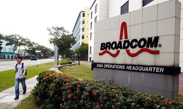 Man passes Broadcom´s Asia operations headquarters office at an industrial park in Singapore in this file photo