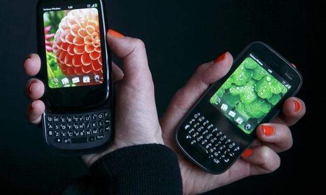 FILE - In this Feb. 2, 2010 file photo, the Palm Pre Plus, left, and the Palm Pixi Plus are shown in 