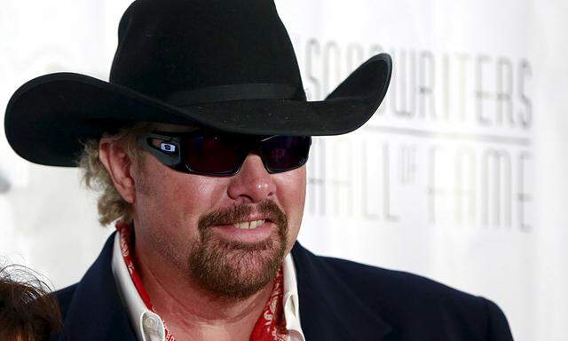 Country singer Toby Keith poses on the red carpet  before the Songwriters Hall of Fame ceremony in New York