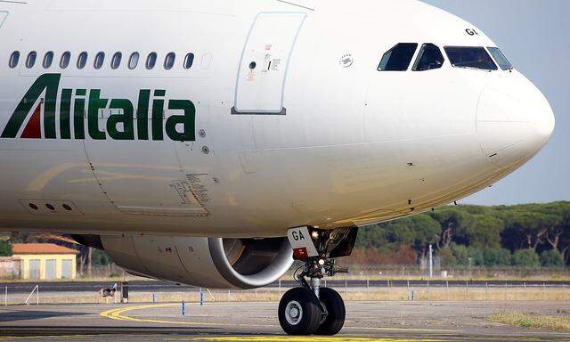 FILE PHOTO: An Alitalia airplane is seen before take off from the Leonardo da Vinci-Fiumicino Airport in Rome