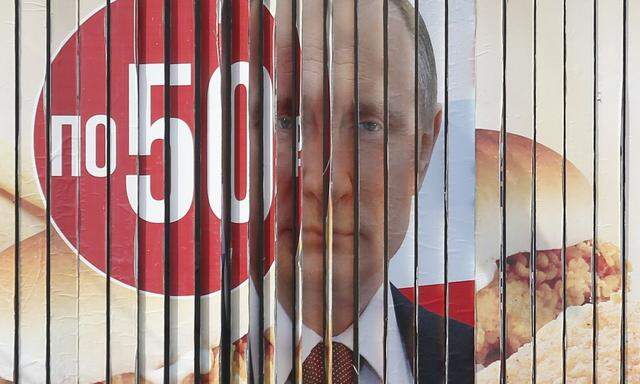 A board, advertising the campaign of Russian President Putin ahead of the presidential election, is on display in Stavropol