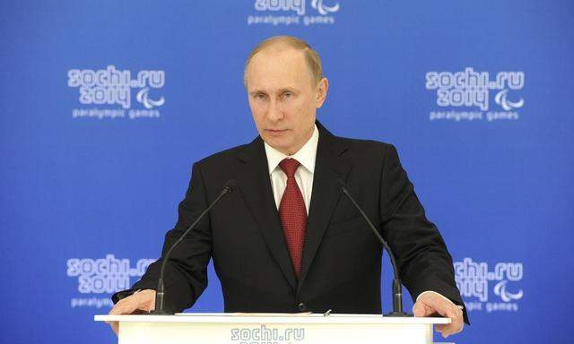 Russian President Vladimir Putin speaks during a meeting with paralympic delegations in Sochi