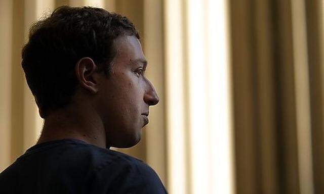 Mark Zuckerberg speaks to reporters during a visit to the Massachusetts Institute of Technology in Ca
