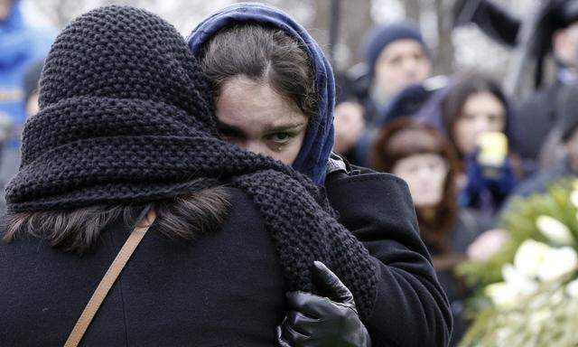 Zhanna, daughter of Russian leading opposition figure Boris Nemtsov, reacts during his funeral in Moscow