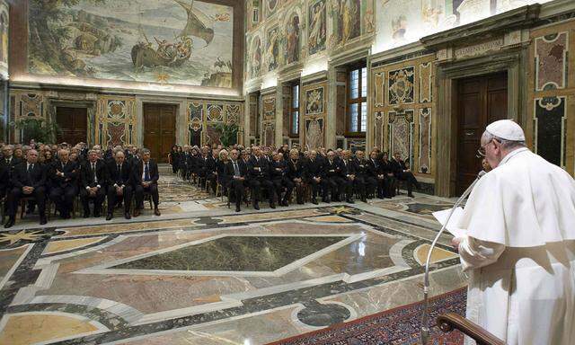 Pope Francis speaks as he leads a meeting with Italian prefects at the Vatican