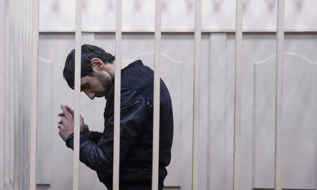 Zaur Dadayev, charged over the killing of Russian opposition figure Boris Nemtsov, stands inside a defendants´ cage at a court building in Moscow