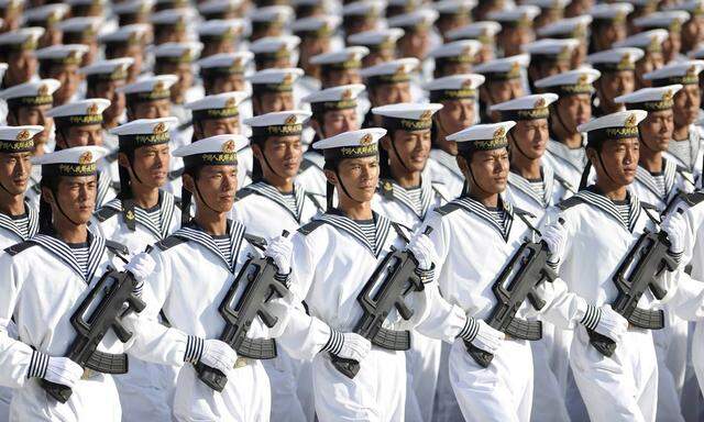 File photo of members of the PLA Navy march in formation during training session on outskirts of Beijing