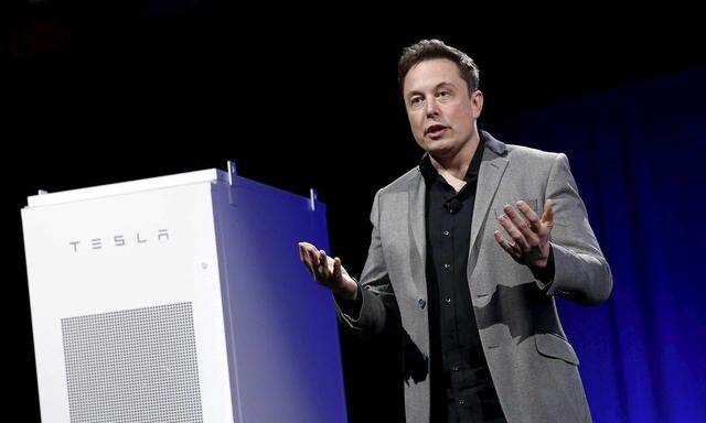 Tesla Motors CEO Elon Musk revealing a Tesla Energy battery for businesses and utility companies during an event in Hawthorne, California