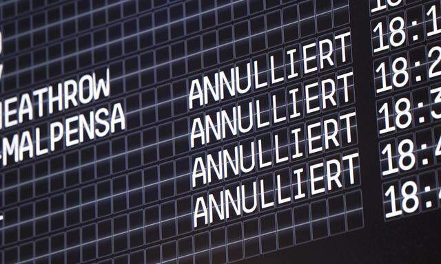 An electronic information board shows cancelled flights at Cologne-Bonn airport