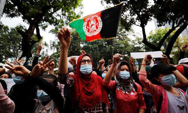 Afghan refugees in Indonesia protest outside the UN Refugee Agency UNHCR's office in Jakarta