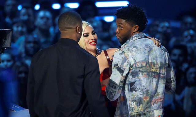 Lady Gaga presents actors Boseman and Jordan with the Best Movie award for 'Black Panther' at the 2018 MTV Movie & TV Awards in Santa Monica