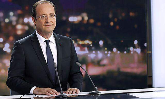 France's President Hollande is seen at the French Television France 2 studios ahead of his appearance