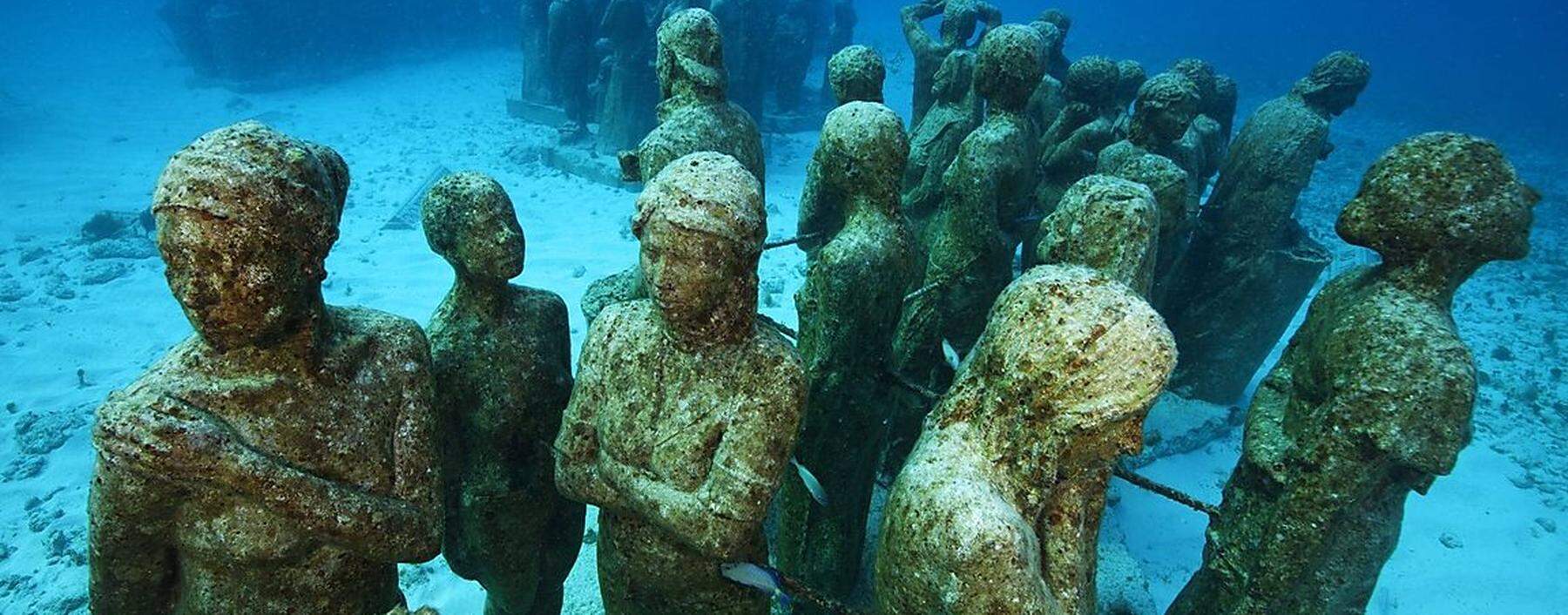 Submarine statues at the MUSA Cancun Underwater Museum a conservation project to promote the growth