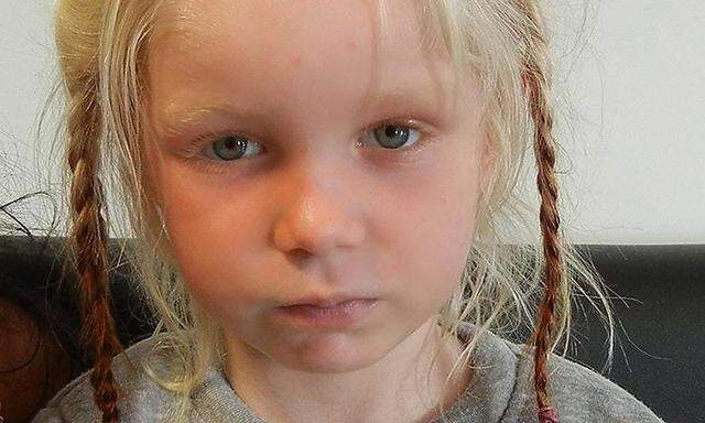 A four-year-old girl, found living with a Roma couple in central Greece, is seen in a handout photo distributed by the Greek police