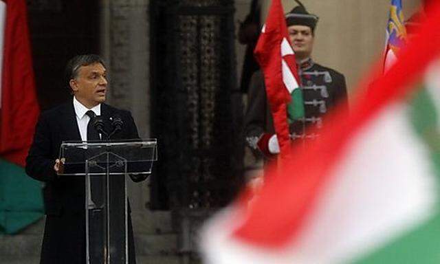 Hungarian Prime Minister Viktor Orban delivers a speech in front of the Hungarian Parliament Building in Budapest