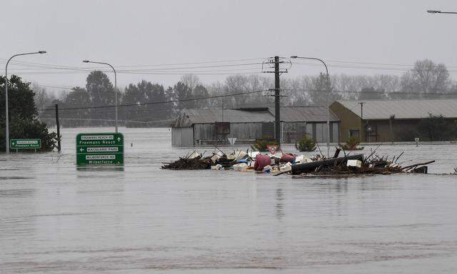 FLOODING NSW, Debris is seen as the the Windsor Bridge is submerged under floodwater from the swollen Hawkesbury River,