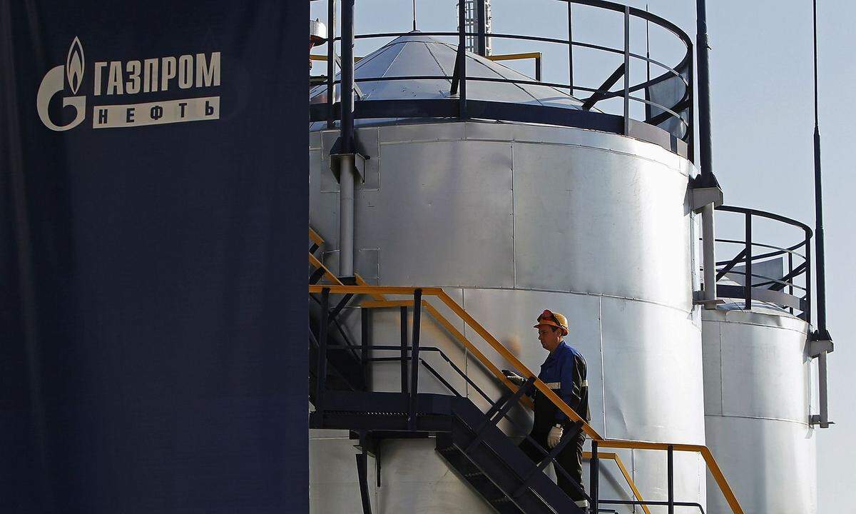 File photo of an employee walking up the stairs at the Gazprom Neft oil refinery in Moscow