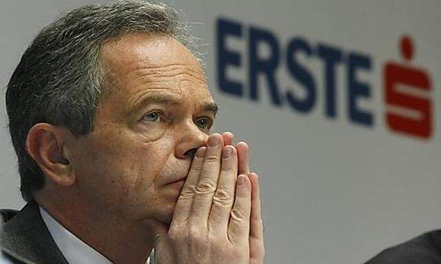 Austrian Erste Bank chief executive Treichl listens during a news conference in Vienna