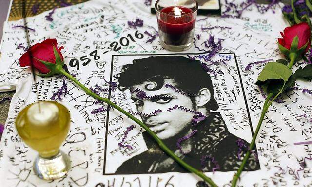 A makeshift memorial is seen as fans gather at Harlem´s Apollo Theater to celebrate the life of deceased musician Prince in the Manhattan borough of New York, U.S.