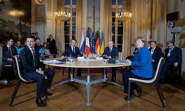 Ukrainian President Zelenskiy, French President Macron, German Chancellor Merkel and Russian President Putin attend a Normandy-format summit in Paris