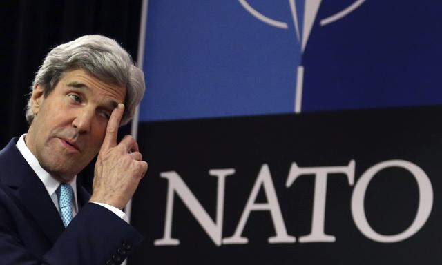 U.S. Secretary of State Kerry arrives at a news conference during a NATO foreign ministers meeting at the Alliance headquarters in Brussels