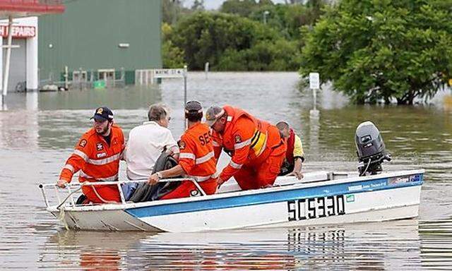 State Emergency Service workers rescue Dell Rutherford from her home in Chinchilla, Queensland, Austr